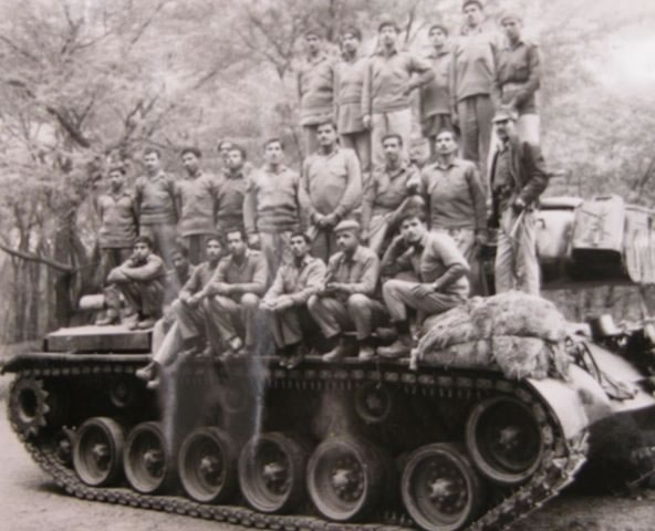 Pakistani Officers and Jawans on a captured Indian Tank.jpg