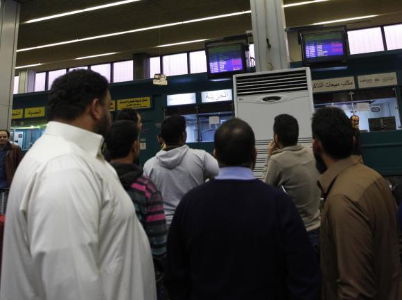 Passengers look at a flight.jpg