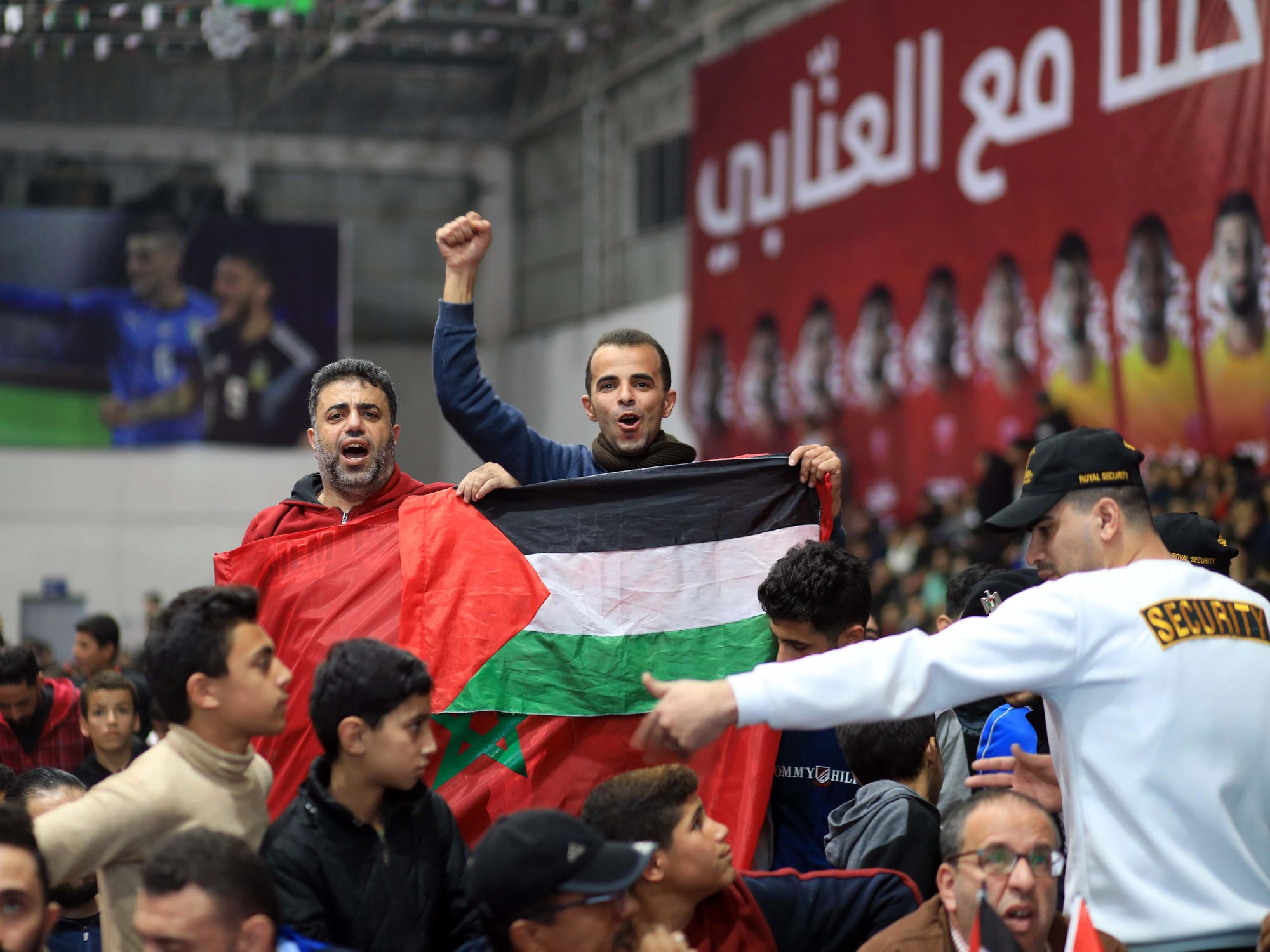 photo-of-two-supporters-of-morocco-with-moroccan-and-palestinian-flags-in-gaza.jpg
