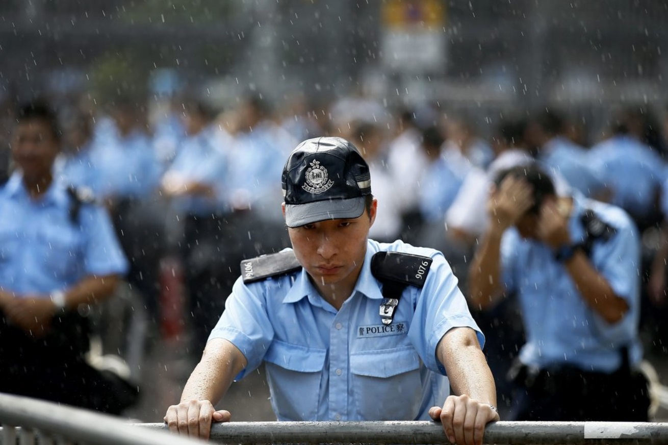 Police officers at Hong Kong’s government offices in Admiralty on Friday.jpg
