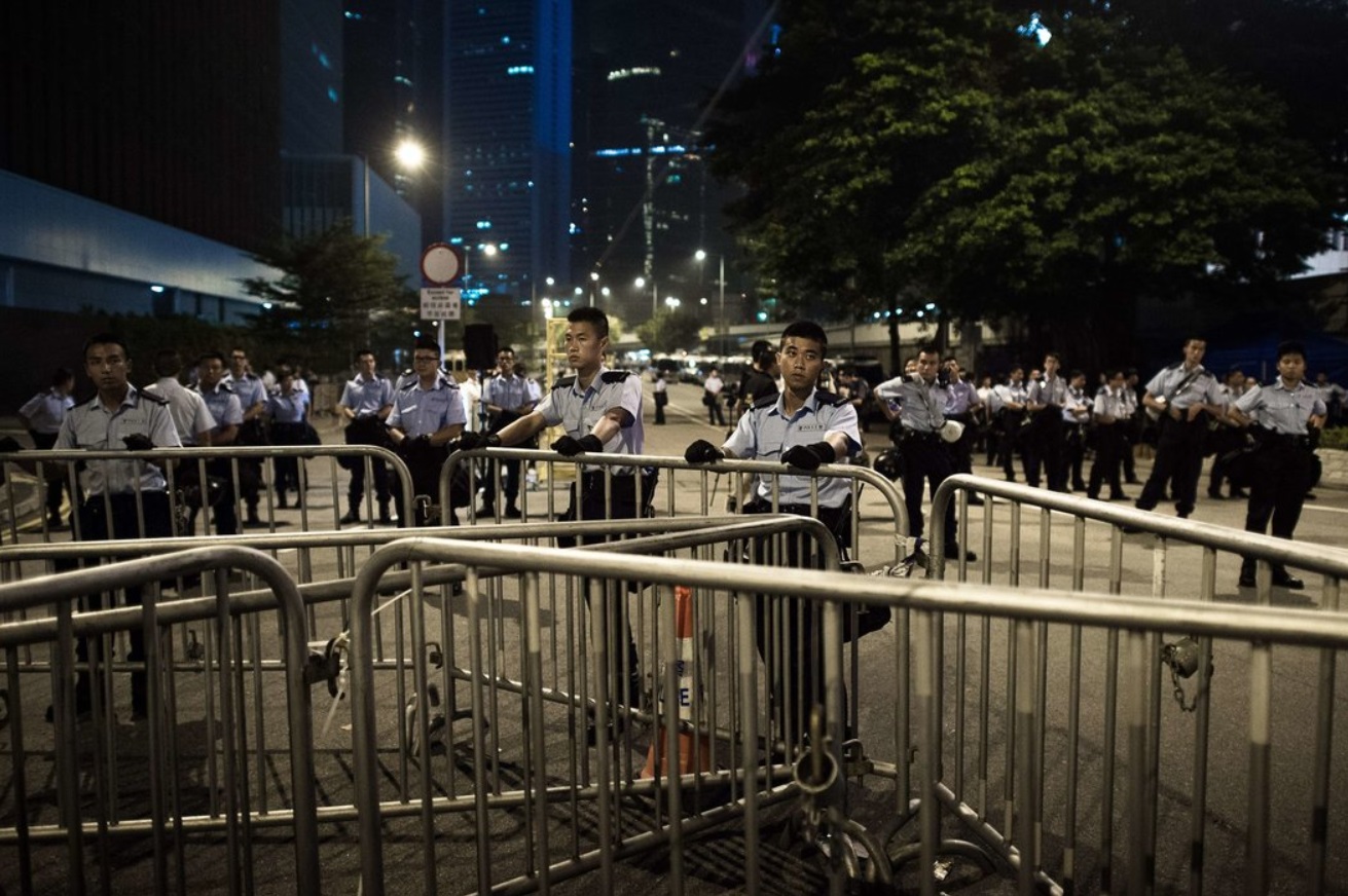 Police stood guard outside the government headquarters in Hong Kong..jpg