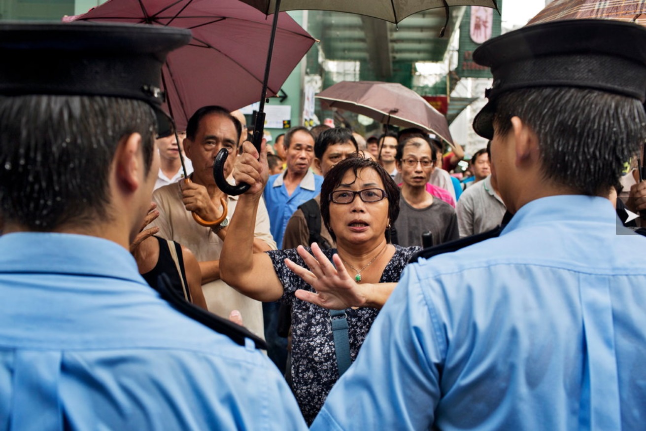 Pro-democracy protesters in two parts of Hong Kong came under assault on Friday.jpg