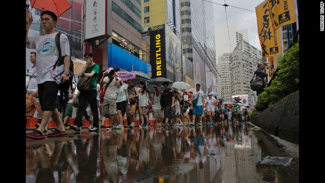 Rain poured down upon protesters intermittently throughout the day..jpg