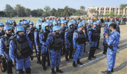Rapid_Action_Force_RAF_personnel_receive_instructions_in_Bathinda.jpg