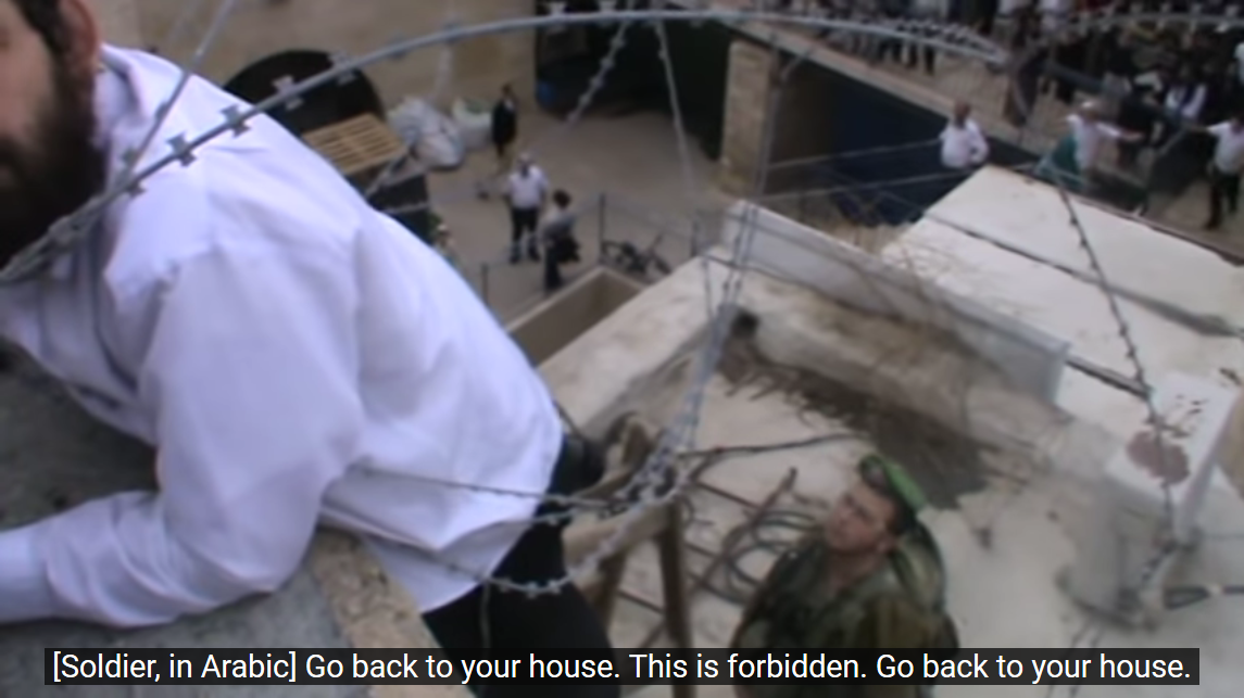 Screenshot_2023-02-27 Hebron - Settler attempts to take down Palestinian flag, 2014 - YouTube(4).png