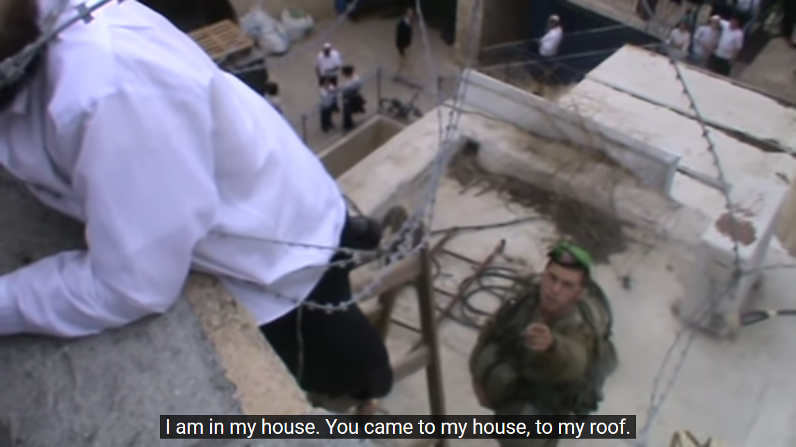 Screenshot_2023-02-27 Hebron - Settler attempts to take down Palestinian flag, 2014 - YouTube(5).png