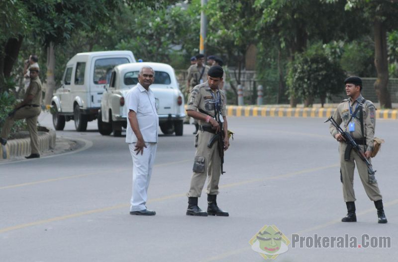 security-personnel-stand-guard-outside-gujarat-190379.jpg