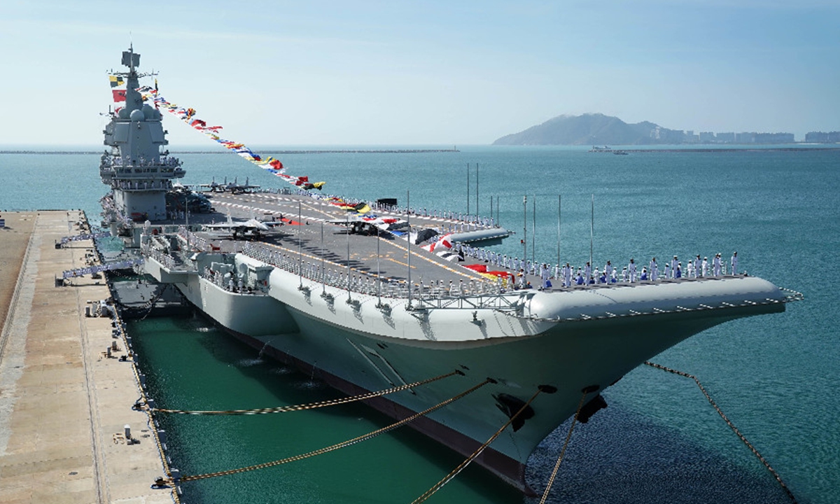 Shandong aircraft carrier is moored at a naval port in Sanya, south China's Hainan Province -...jpeg