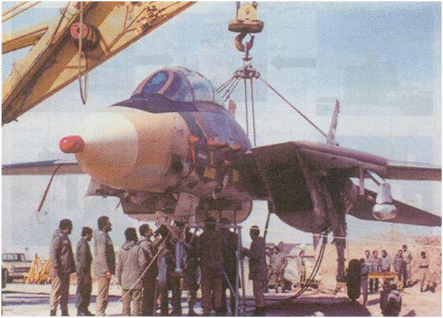 The F-14 hung by a crane for release and firing sequence test.jpg