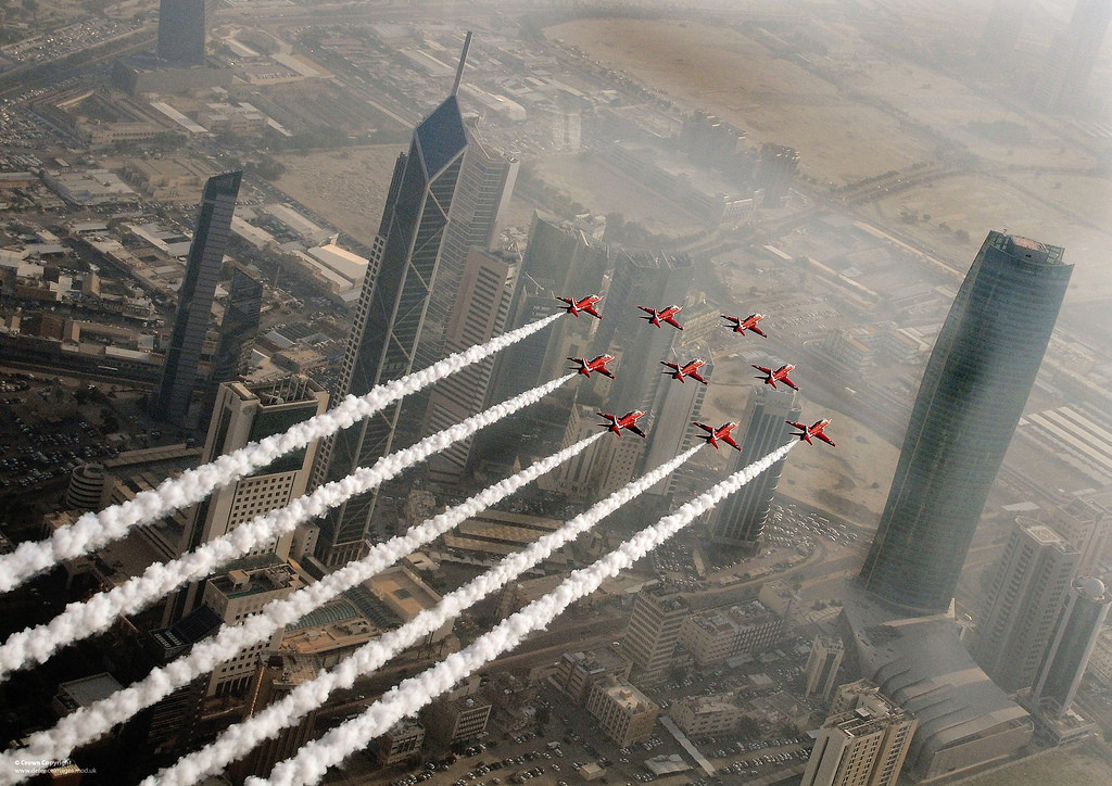 The Red Arrows flying in formation over the Al Hamra Tower in Kuwait City.jpg