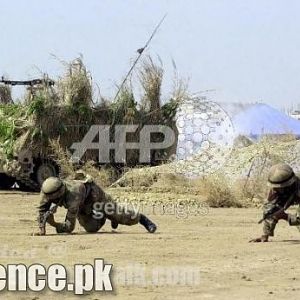 Military Vehicle and Pakistani Soldiers