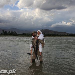 Pakistani Soldier Helping a Man
