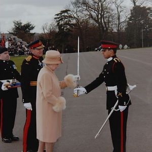 Queen Elizabeth of Britain awarding â€œSword of Honourâ€￾ to Pakistani Officer