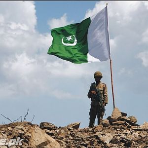Pakistan flag fluttering after capturing mountain