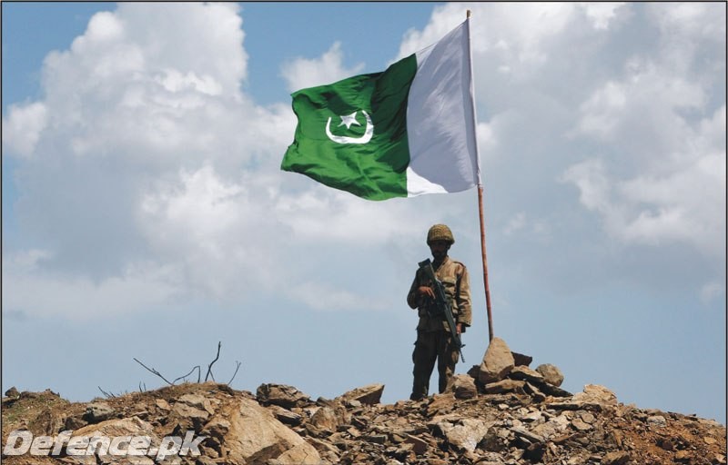 Pakistan flag fluttering after capturing mountain