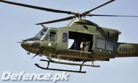 Pakistani heli flies near the Baine Baba Ziarat mountain