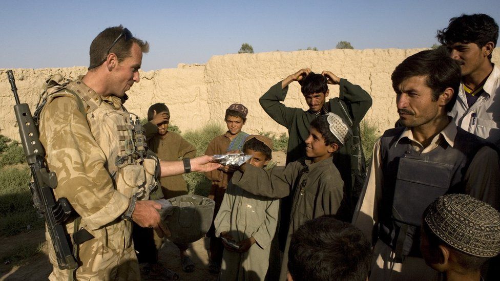 A British soldier meets Afghans