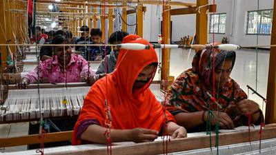 Weavers making clothing at the Dhakai Muslin Project facility in Narayanganj, Bangladesh. The country’s ready-made garment exports to a steadily growing global market now stand at more than $35 billion a year. AFP