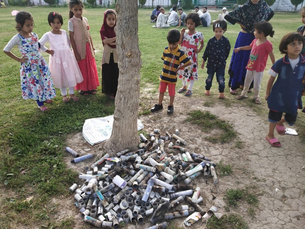 On-September-1-local-children-gather-around-a-tree-outside-a-shrine-standing-in-front-of-teargas-canisters-fired-by-the-government-forces-to-disperse-protestors-in-SouraSrinagar-in-late-August.-1024x768.jpg