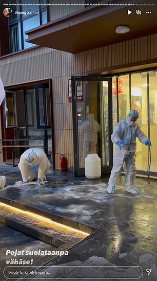 Desperate staff try to dry the stairs outside with hand towels