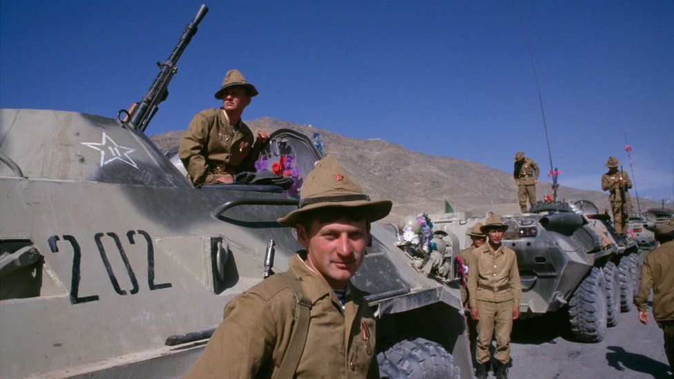 View of Soviet army soldiers as they stand on an around armoured personnel carriers during the final Soviet troop withdrawal ceremony, Kabul, Afghanistan, May 15, 1988