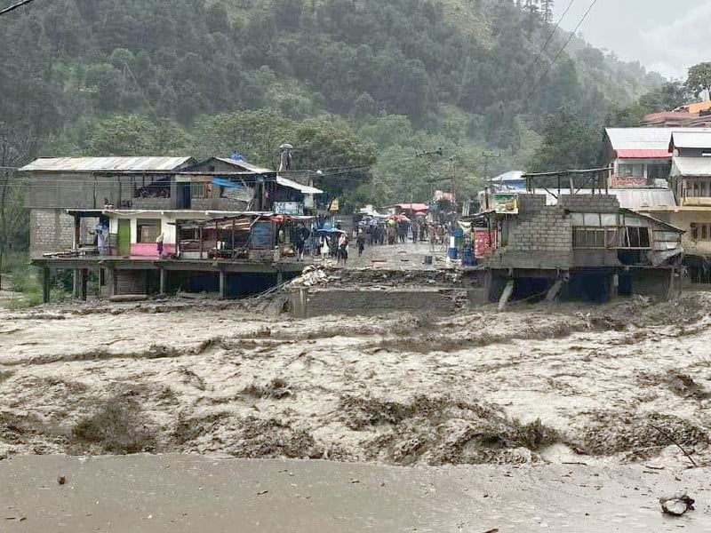 flash flood inundates mahabdri bazaar and munawar nullah damaging stores and goods in balakot travelers wait on kaghan highway after its closure by a landslide photos zulfiqar ali express