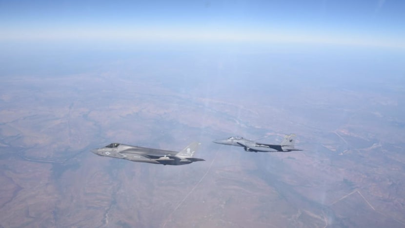 an_rsaf_fighter_aircraft_flying_alongside_the_usmcs_f-35b.jpg