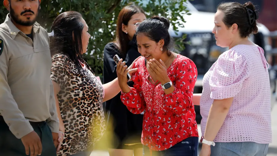 A woman reacts outside the Ssgt Willie de Leon Civic Center, where students had been transported from Robb Elementary School after a shooting, in Uvalde, Texas, May 24, 2022.