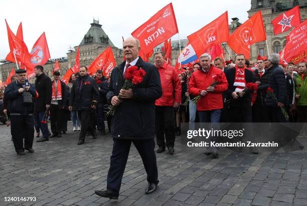 russian-communist-party-chairman-gennady-zyuganov-holds-flowers-during-the-rally-at-red.jpg