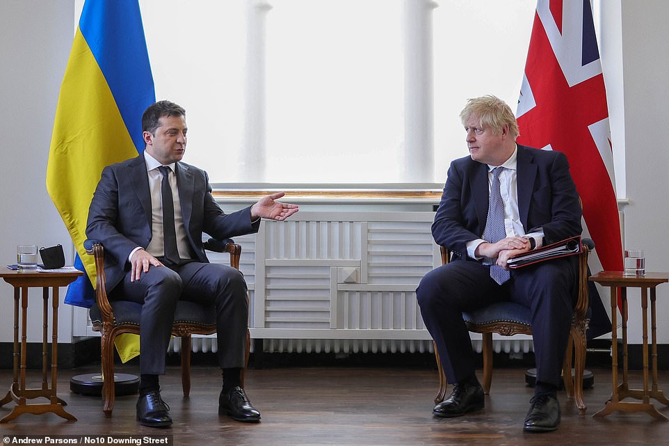 Prime Minister Boris Johnson greets the Ukrainian President, Volodymyr Zelenskyy for bilateral talks during the Munich Security Conference on Saturday