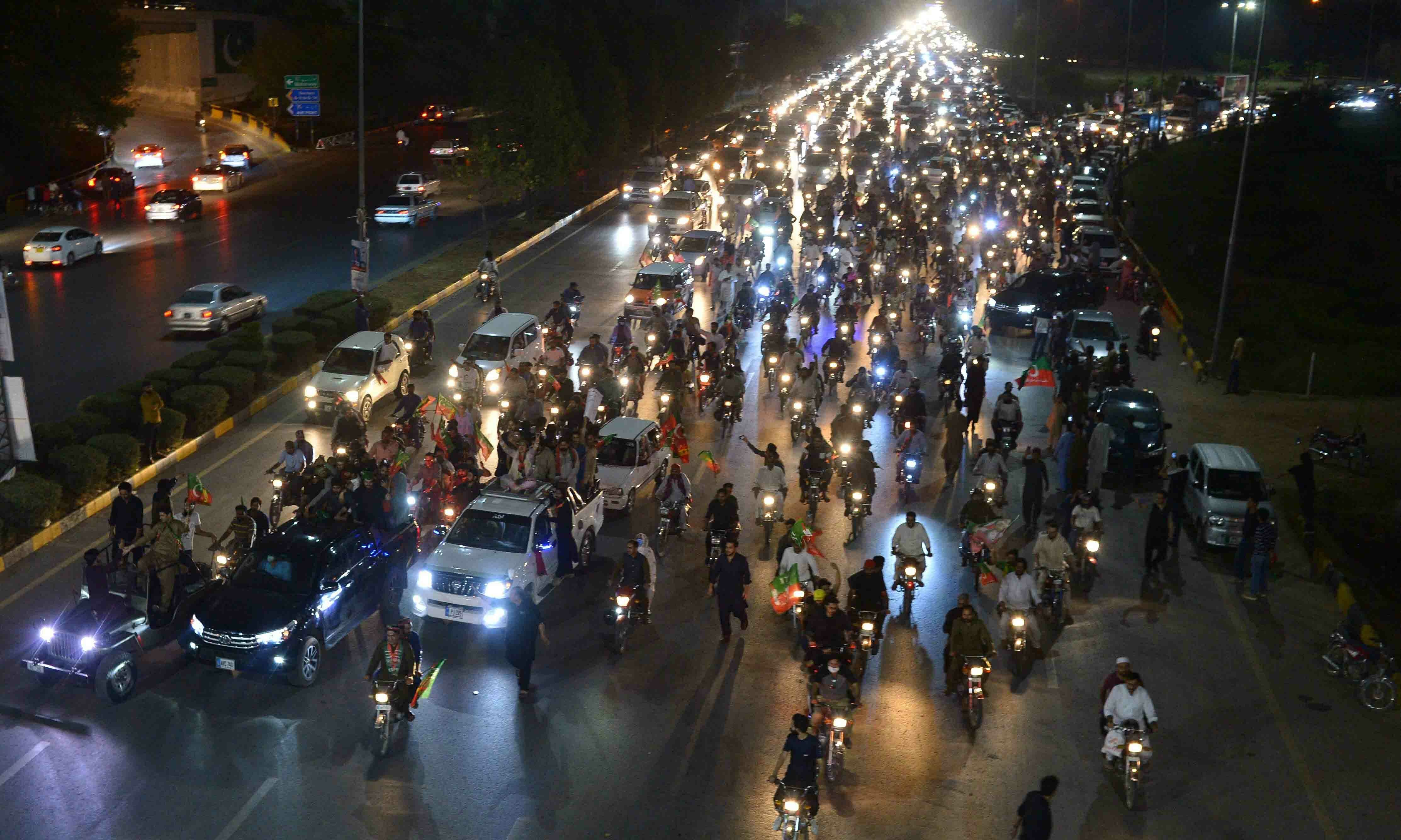 PTI supporters take part in a rally in support of former prime minister Imran Khan in Islamabad on April 10. — AFP