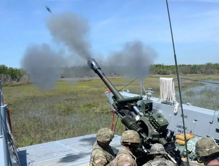 US_field_artillery_fired_M119_howitzer_from_landing_craft_in_Operation_Gator_2.jpg