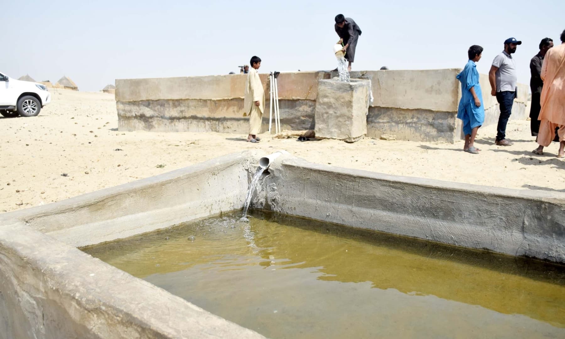 Water is transferred to a storage tank in Achhro Thar, Khipro, Sindh. — Photo by Umair Ali