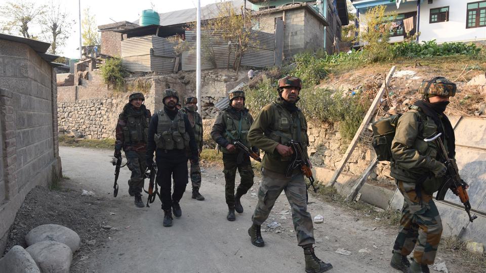 In this picture from November 6, army soldiers near the site of a gunfight with militants in Meej village, Pampore in Pulwama district, Jammu and Kashmir.