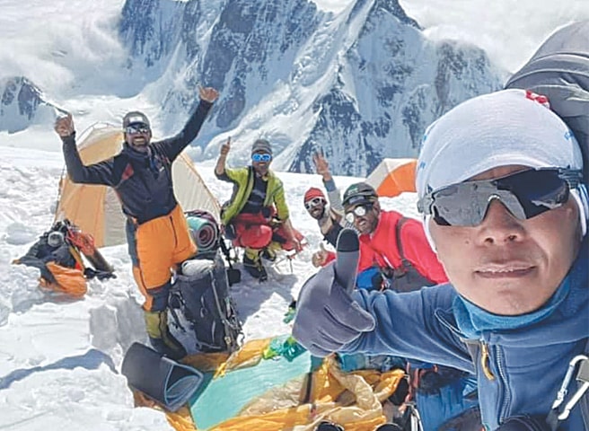 Mountaineers take a selfie at one of the last camps before the K2 summit.—Dawn