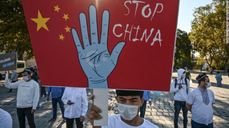 Supporters of China's Uyghur minority hold placards as they gather at the Beyazit Square on October 1, 2020 during a demonstration in Istanbul, Turkey.'s Uyghur minority hold placards as they gather at the Beyazit Square on October 1, 2020 during a demonstration in Istanbul, Turkey.