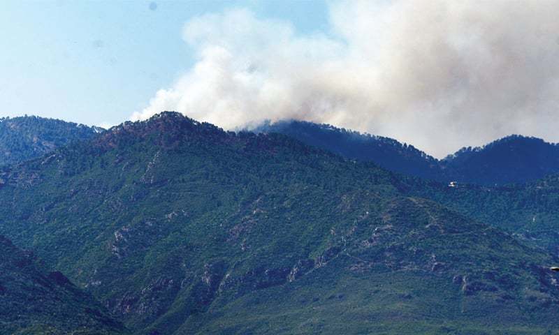 This file photo shows smoke rising from a fire in the Margalla Hills. — White Star