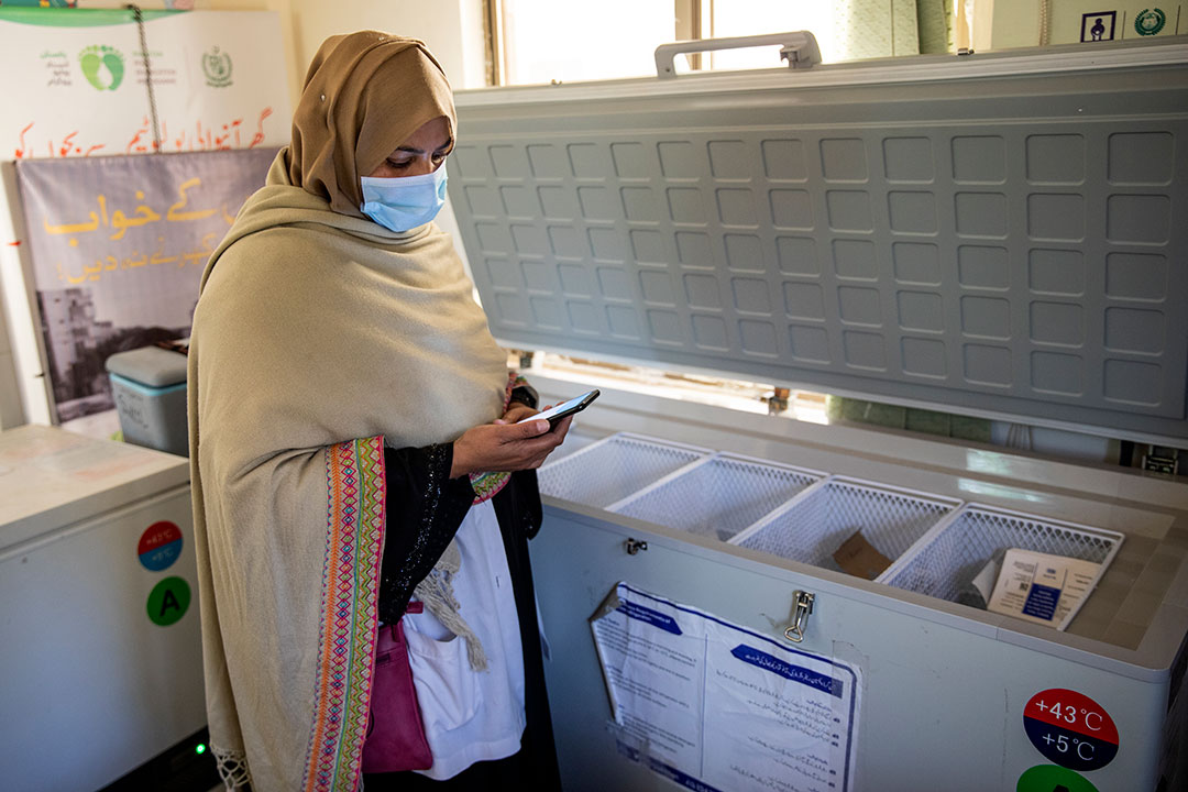 Nighat Rani, a vaccinator in Islamabad, logs into an electronic immunisation register before heading into the field. Credit: Gavi/2020/Asad Zaidi