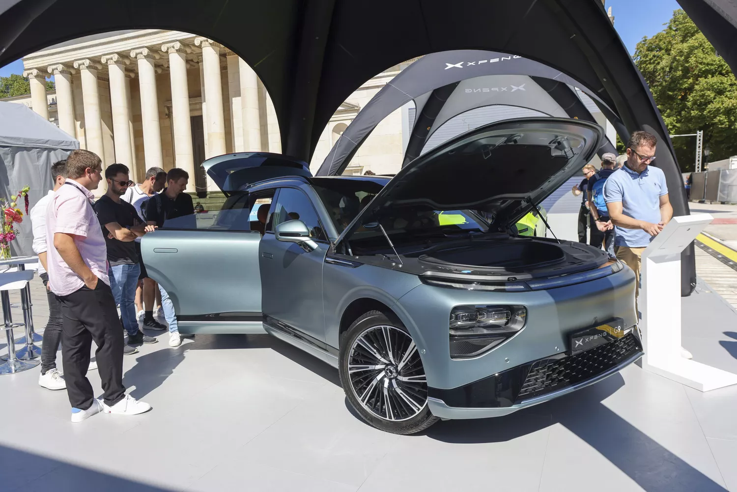 People look at an Xpeng G9 electric vehicle at the Munich Motor Show in September 2023