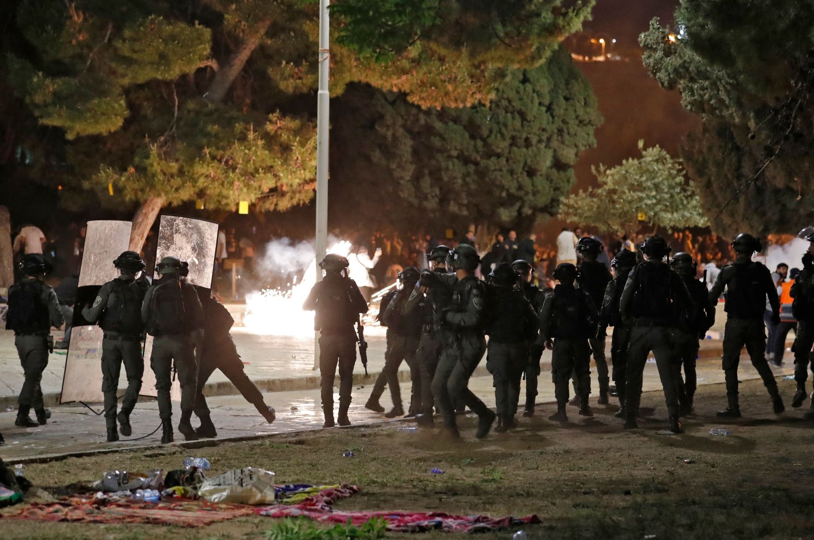 Israeli security forces are seen as they enter Al-Aqsa Mosque in Jerusalem, attacking Muslim worshippers with stun grenades during prayers, May 7, 2021. (AFP Photo)