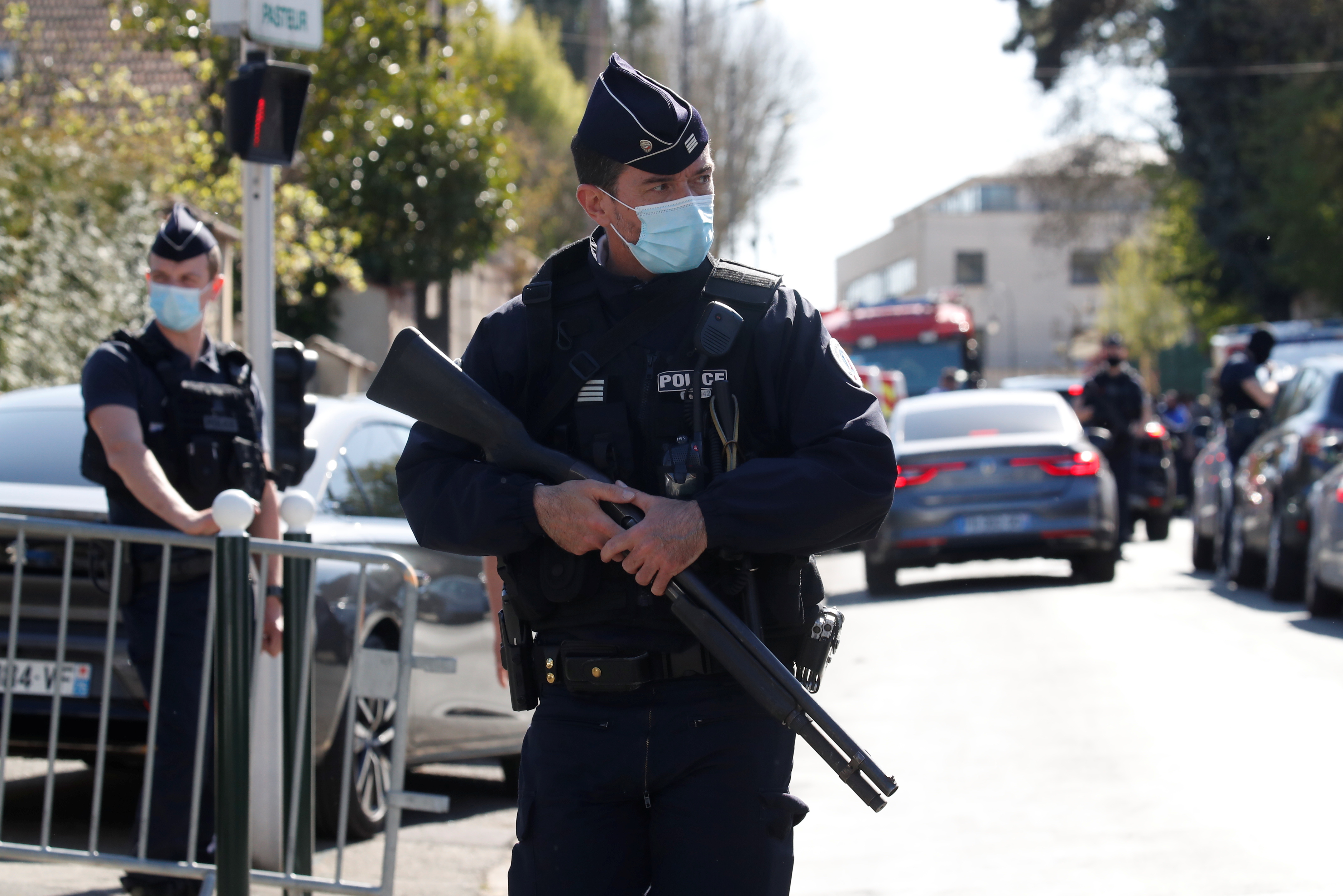 Police officers secure the area where an attacker stabbed a female police administrative worker, in Rambouillet, near Paris, France, April 23, 2021. REUTERS/Gonzalo Fuentes