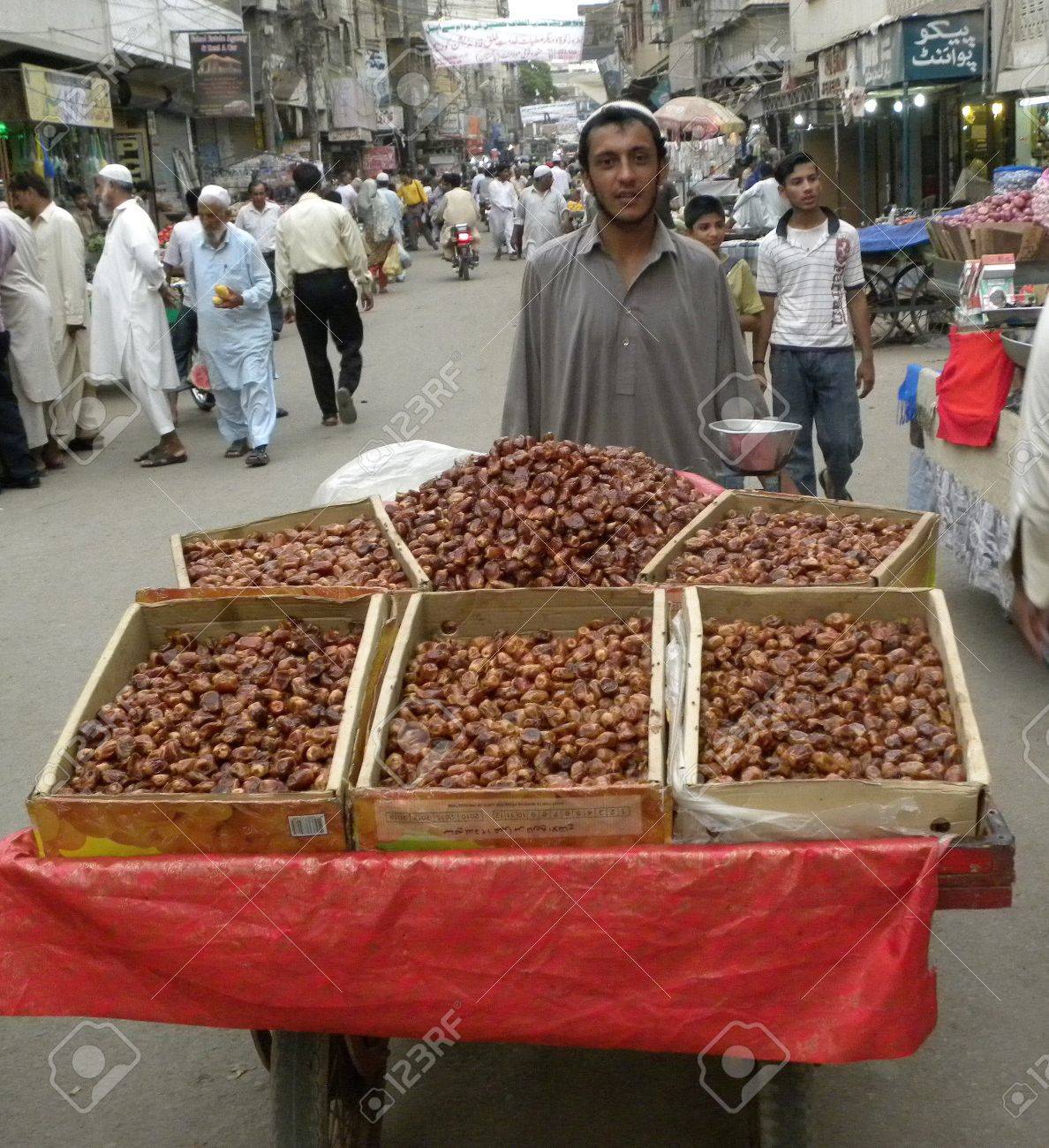 14542171-PAKISTAN-KARACHI-STREET-VENDOR-SELLING-DATES-IN-THE-STREET-IN-THE-HOLY-MONTH-OF-RAMADAM-TODAY-ON-TUE-Stock-Photo.jpg