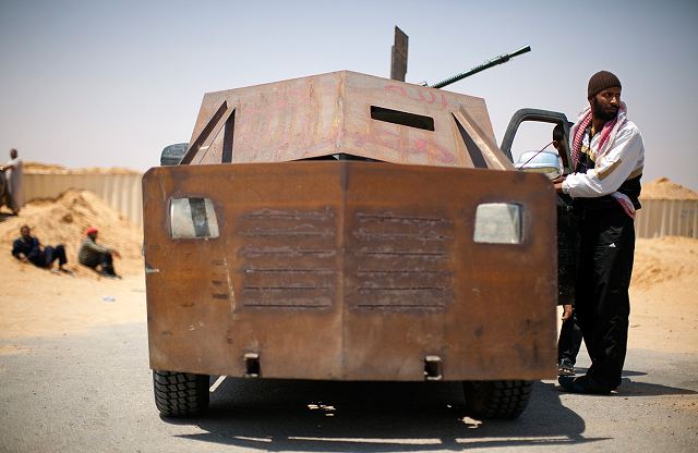 Libyan_rebel_fighter_in_a_vehicle_rigged_with_armour_plates_27_May_2011_near_Misrata_001.jpg