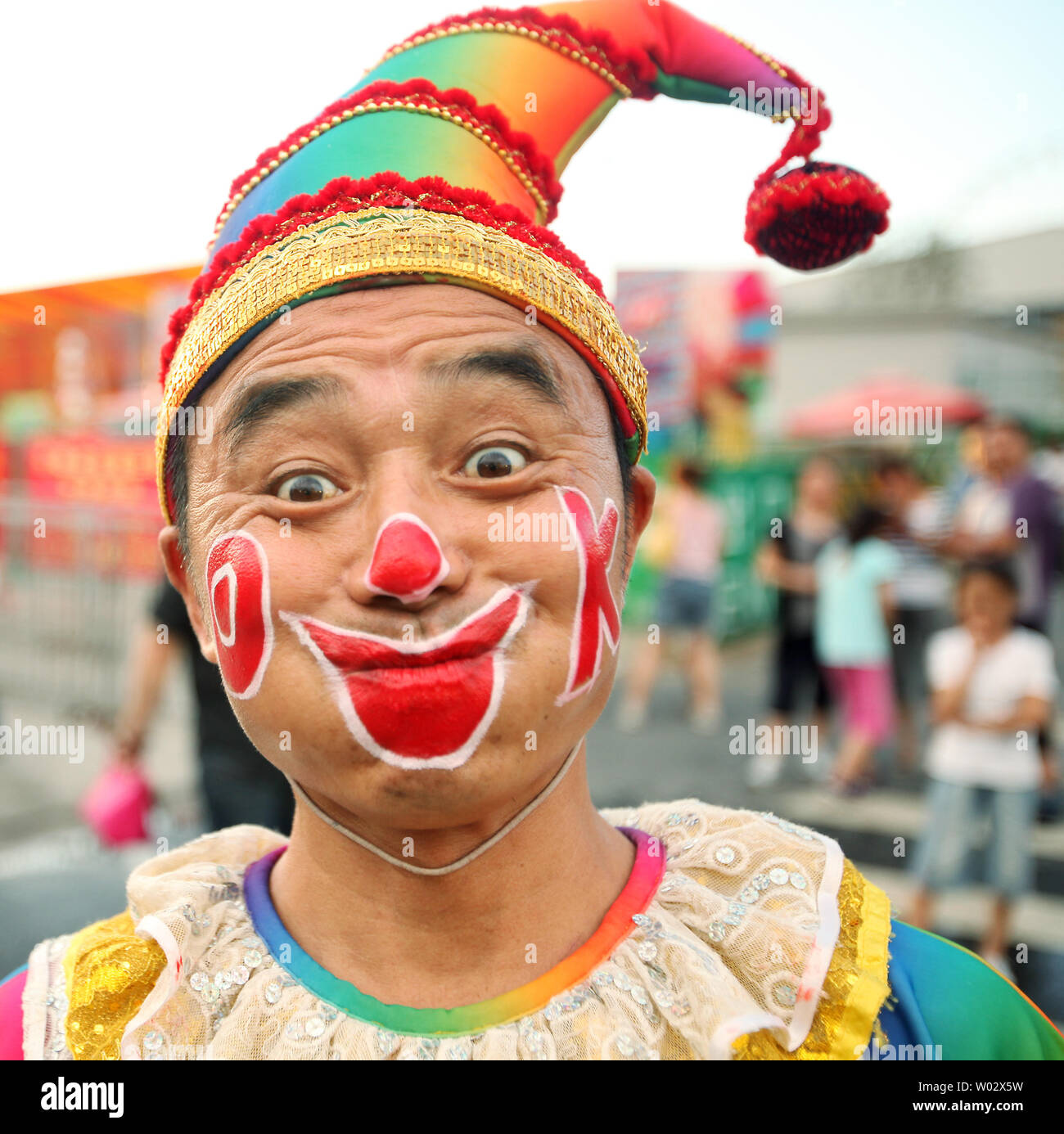 a-chinese-clown-stands-outside-a-russian-circus-hoping-to-attract-customers-in-beijing-on-august-26-2009-upistephen-shaver-W02X5W.jpg