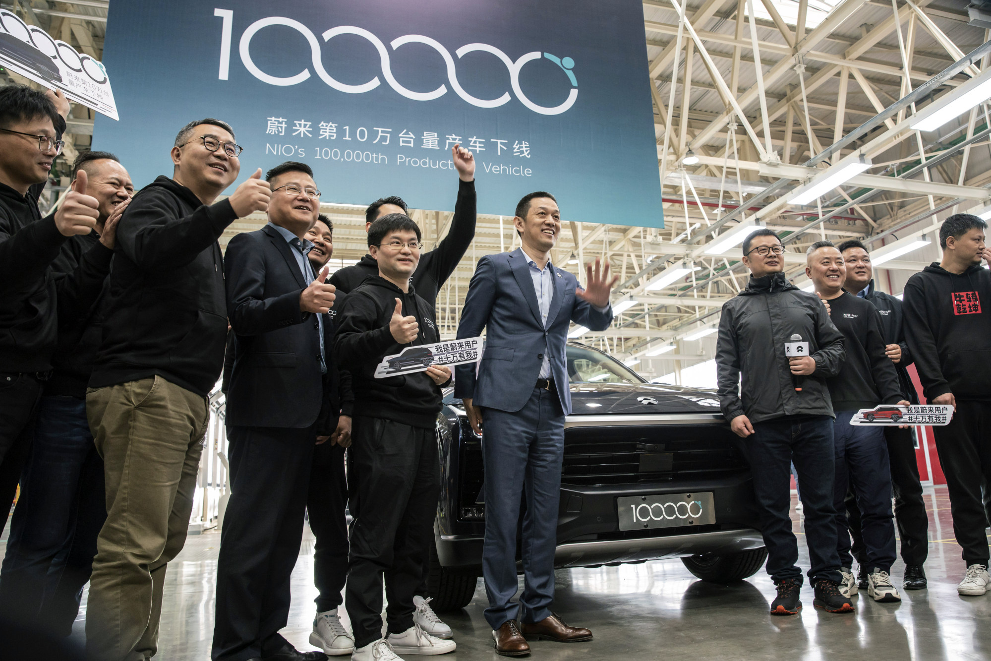 William Li, CEO of Nio, centre, at an event marking the roll-out of the company’s 100,000th electric vehicle at the automaker’s factory in Hefei, Anhui province, China, on April 7. Photo: Bloomberg