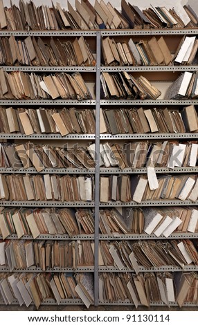 stock-photo-close-up-of-old-vintage-files-in-a-storage-room-91130114.jpg