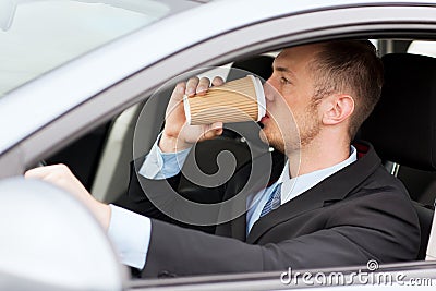 man-drinking-coffee-driving-car-transportation-vehicle-concept-34106482.jpg