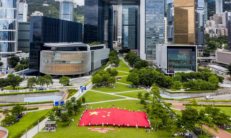 Aerial photo taken on June 25, 2020 shows people displaying China's national flag in Tamar Park in Hong Kong, China. (Photo: Xinhua)
