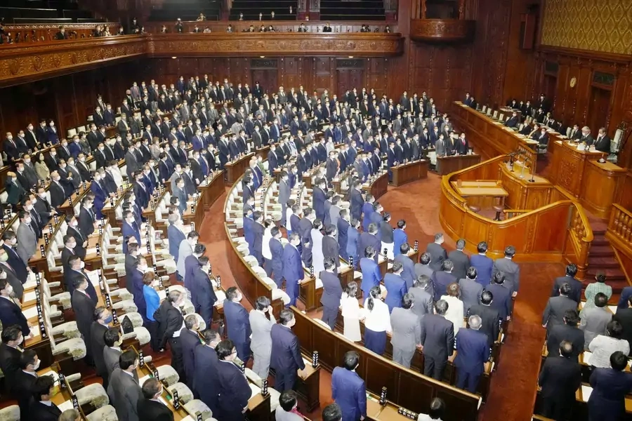 Lawmakers stand up to show their support as Japan's parliament adopts resolution on human rights in China at the parliament in Tokyo's parliament adopts resolution on human rights in China at the parliament in Tokyo