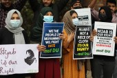 Muslim students and members of Muslim Students Federation protest against the recent hijab ban in New Delhi [Rajat Gupta/EPA]